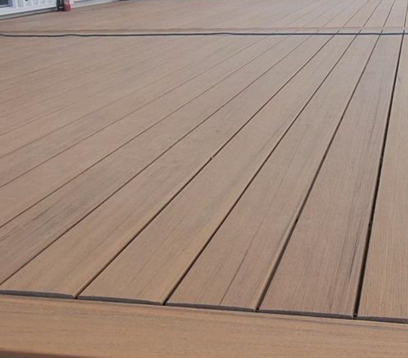 Wooden deck with horizontal, tan-brown planks.