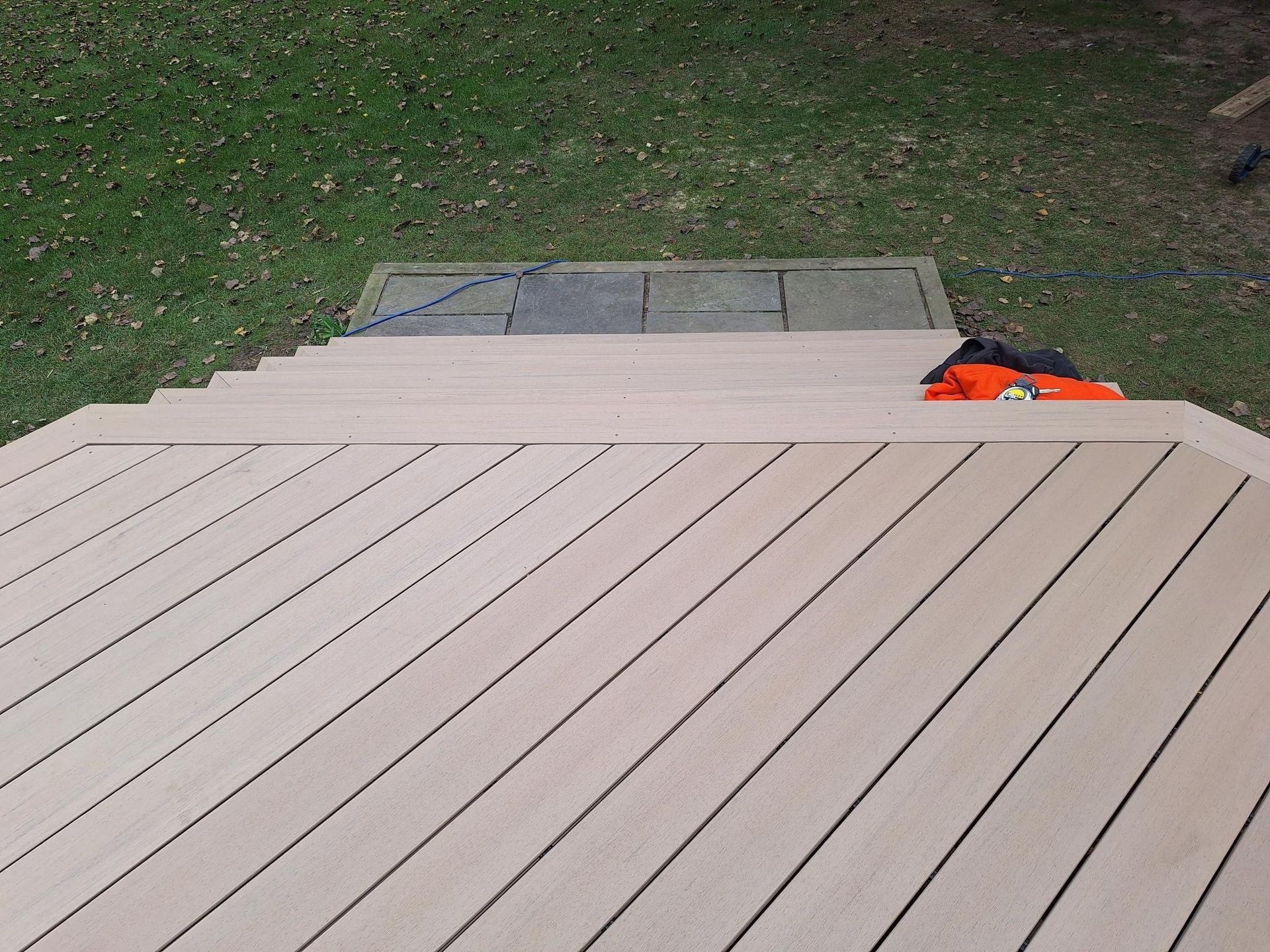 A wooden deck with stairs leading up to it.