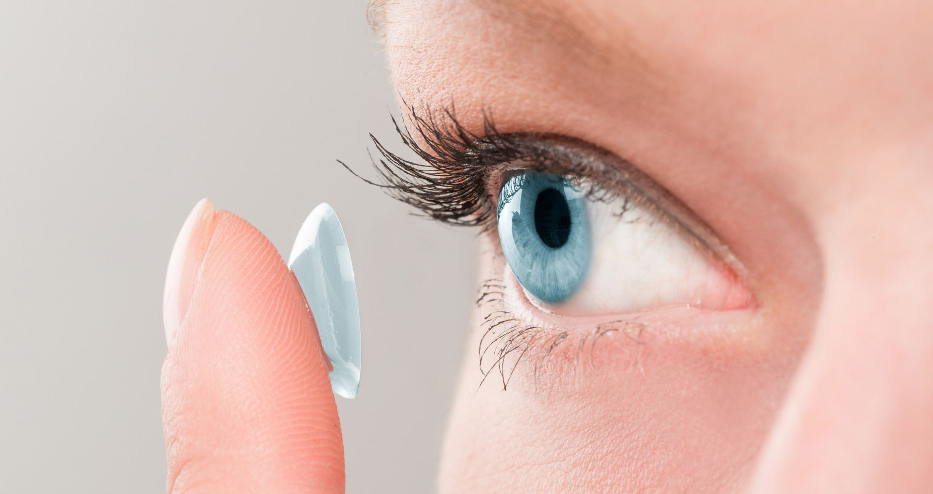 Woman Putting Contact Lense — Evesham, NJ — Tristate Eyecare