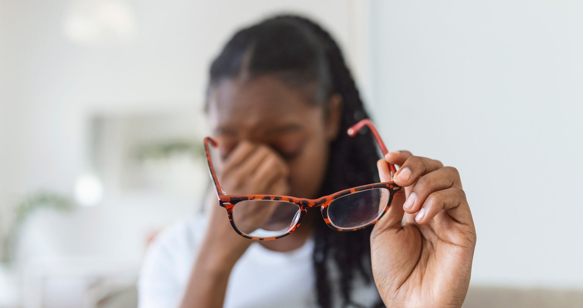 Girl Holding Eyeglass And Rubs Her Eyes — Evesham, NJ — Tristate Eyecare