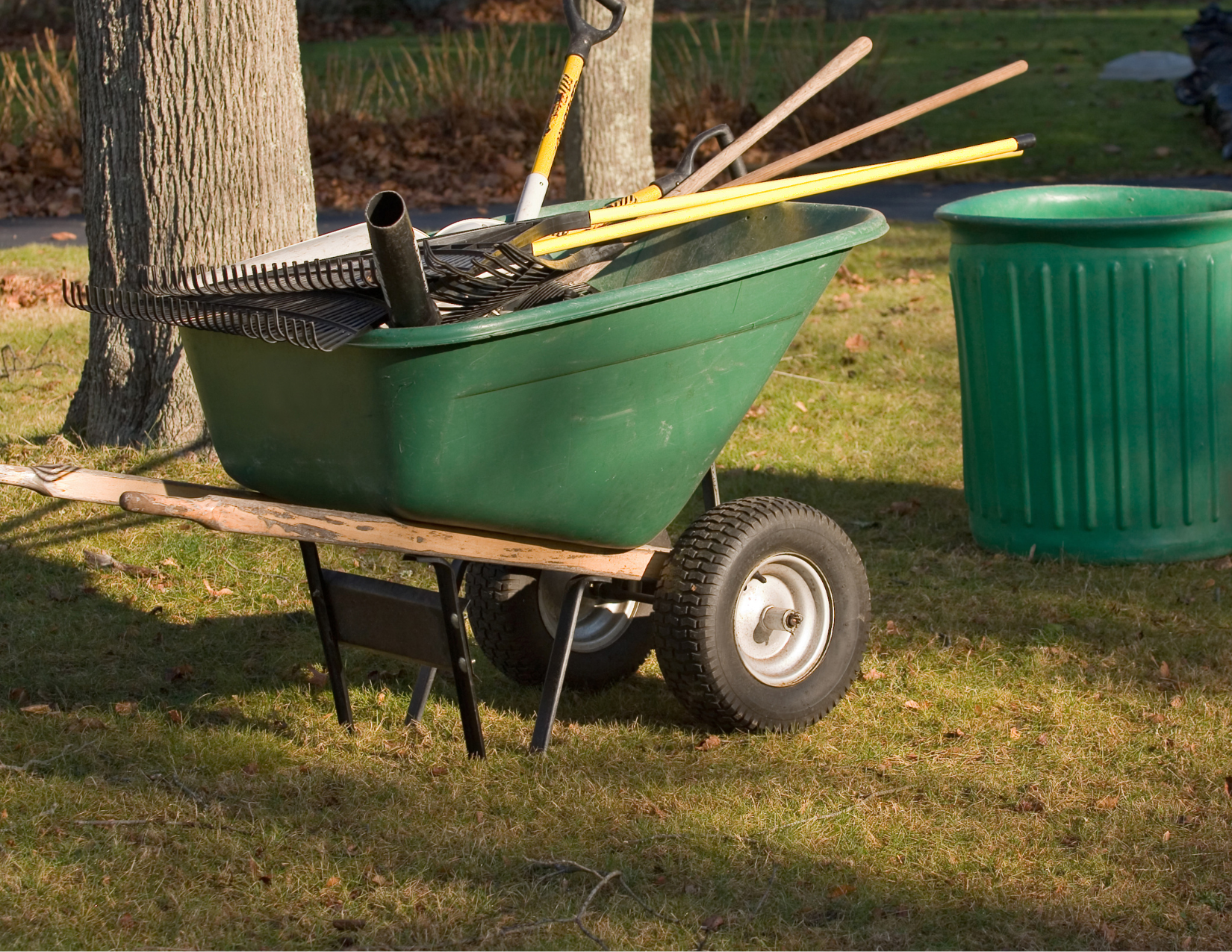 Wheelbarrow full of tools for yard cleanup