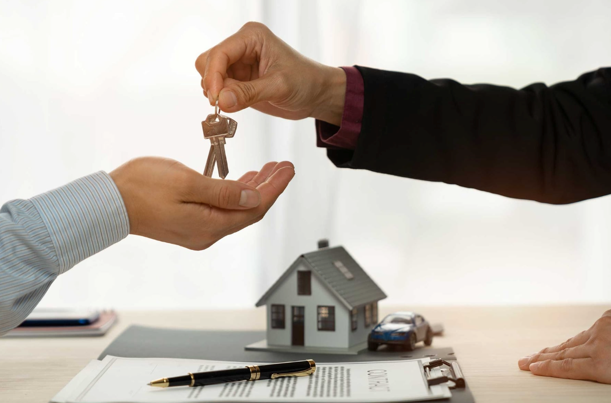Handing home keys to someone