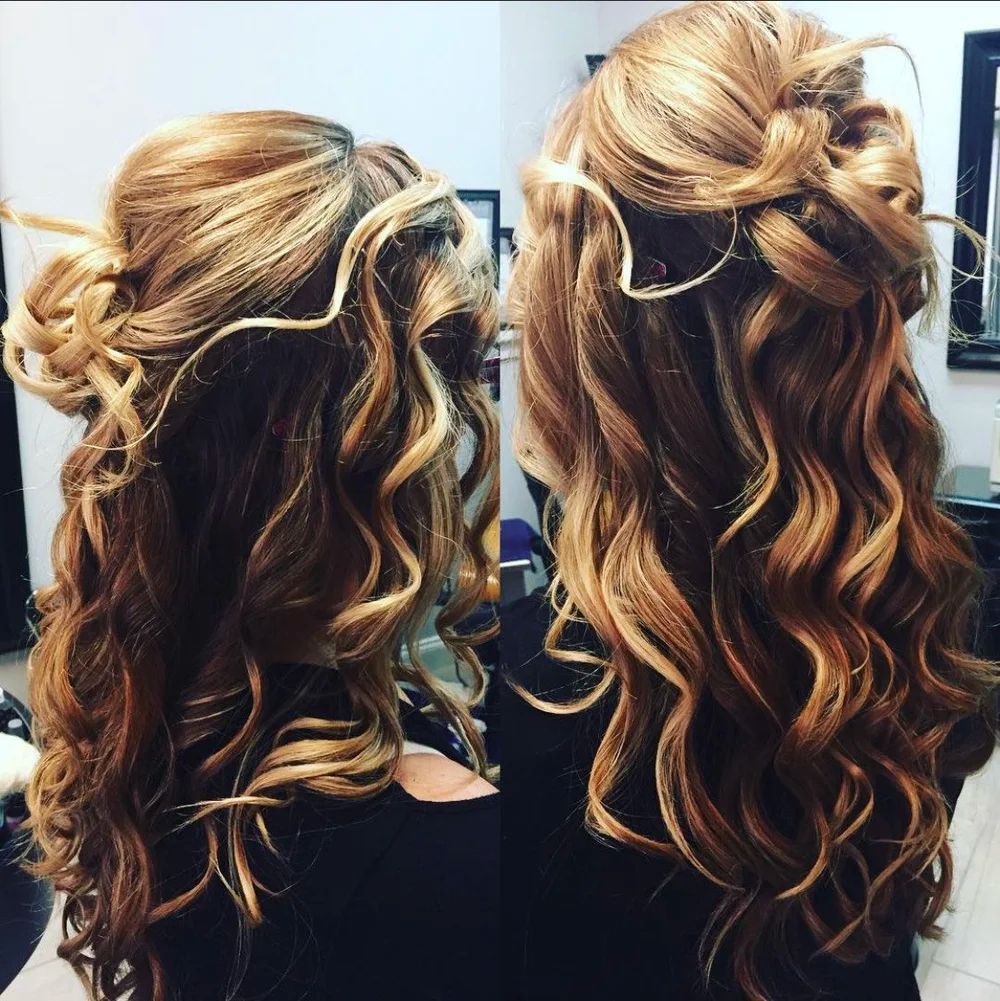Two women with long, wavy, highlighted hair in similar updo styles.