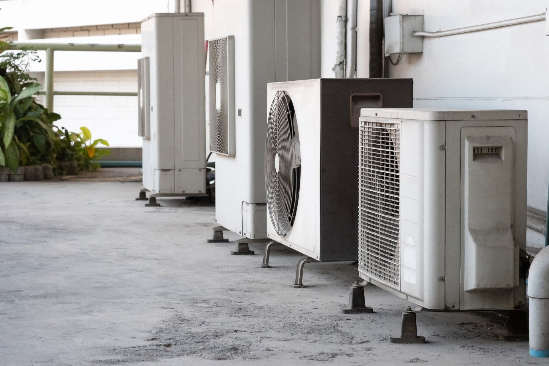 Man Fixing an AC — Newport, NC — Plisko Service Solutions