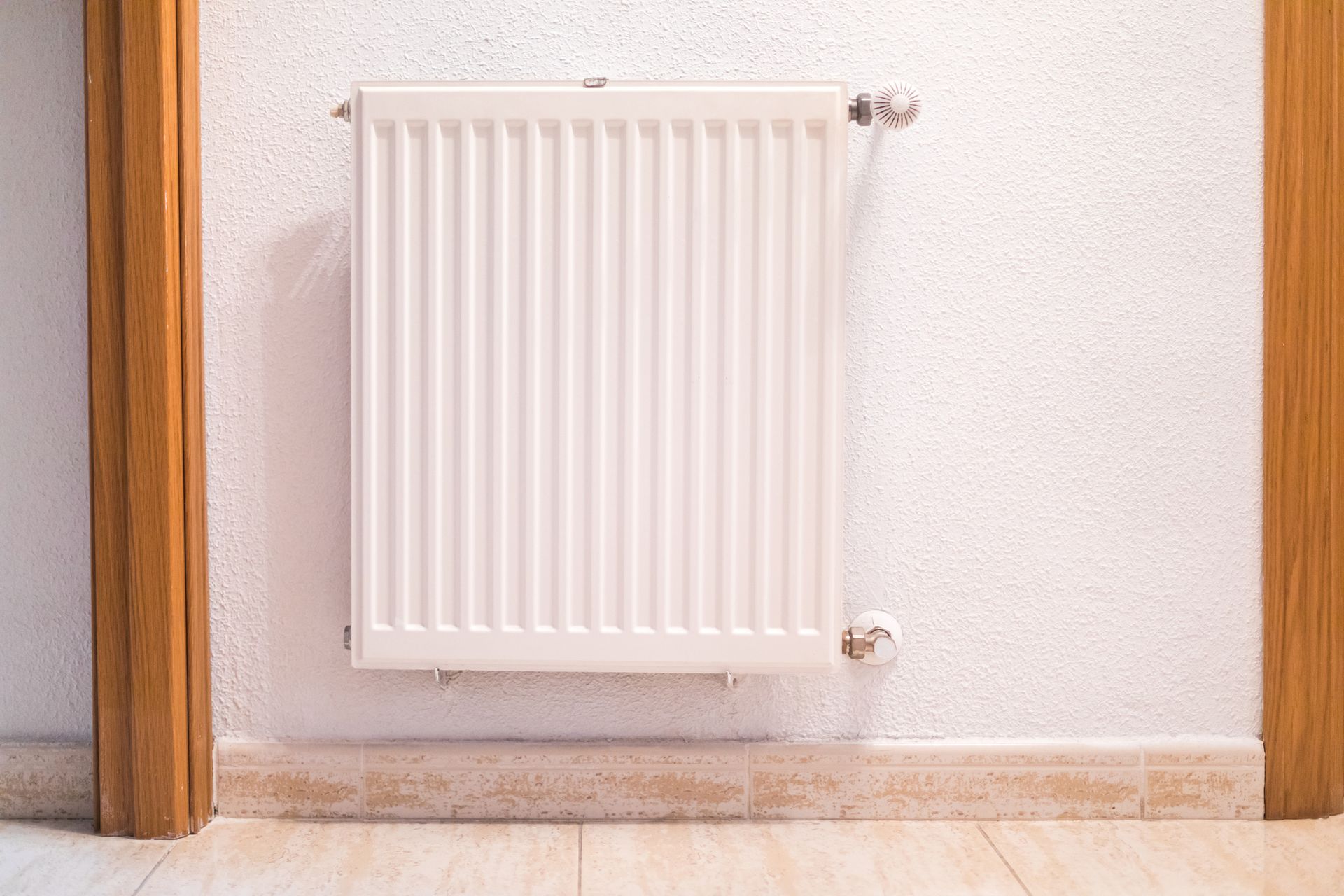 White iron heating radiator, showcasing an emergency heating contractor in Newport, NC’s work.