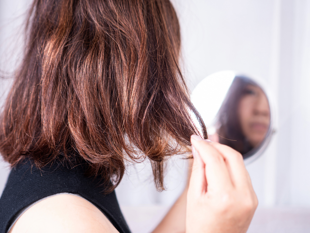 Faded hair colour with dry ends showing uneven tone and lack of shine