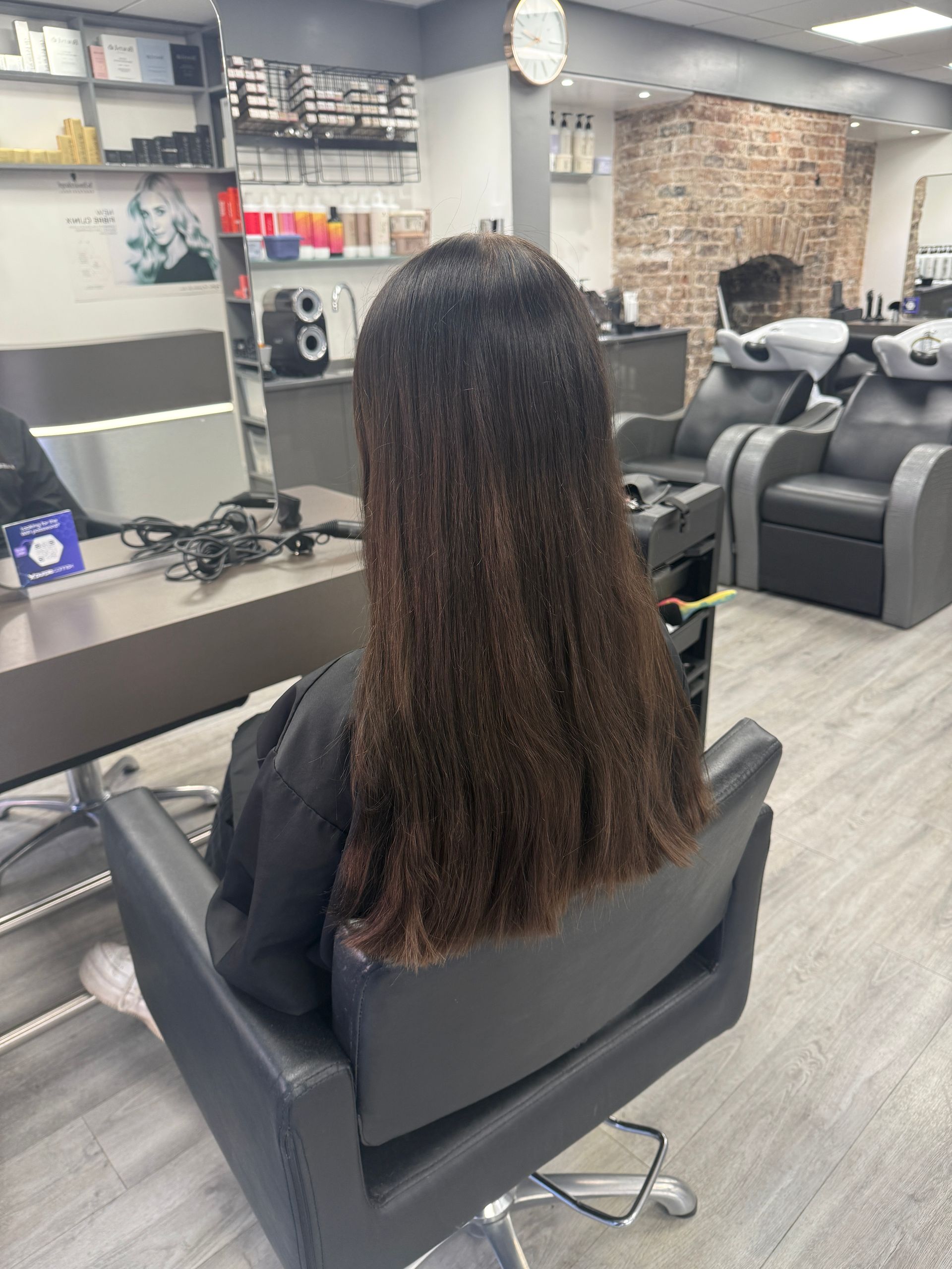 Before colour correction showing dark box dyed hair prior to professional pigment removal