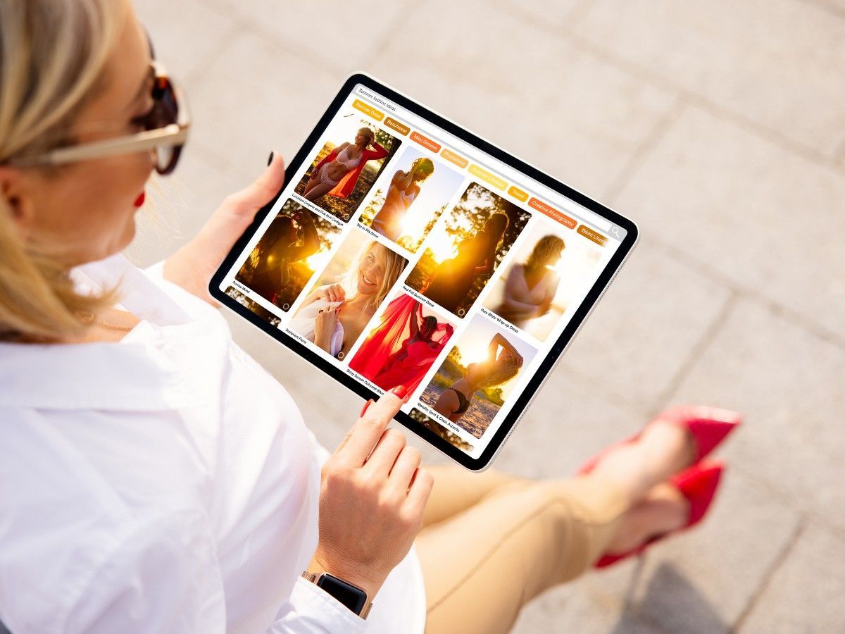 Client reviewing hair inspiration photos before a consultation at THE TRUTH IN COLOUR™ Newcastle