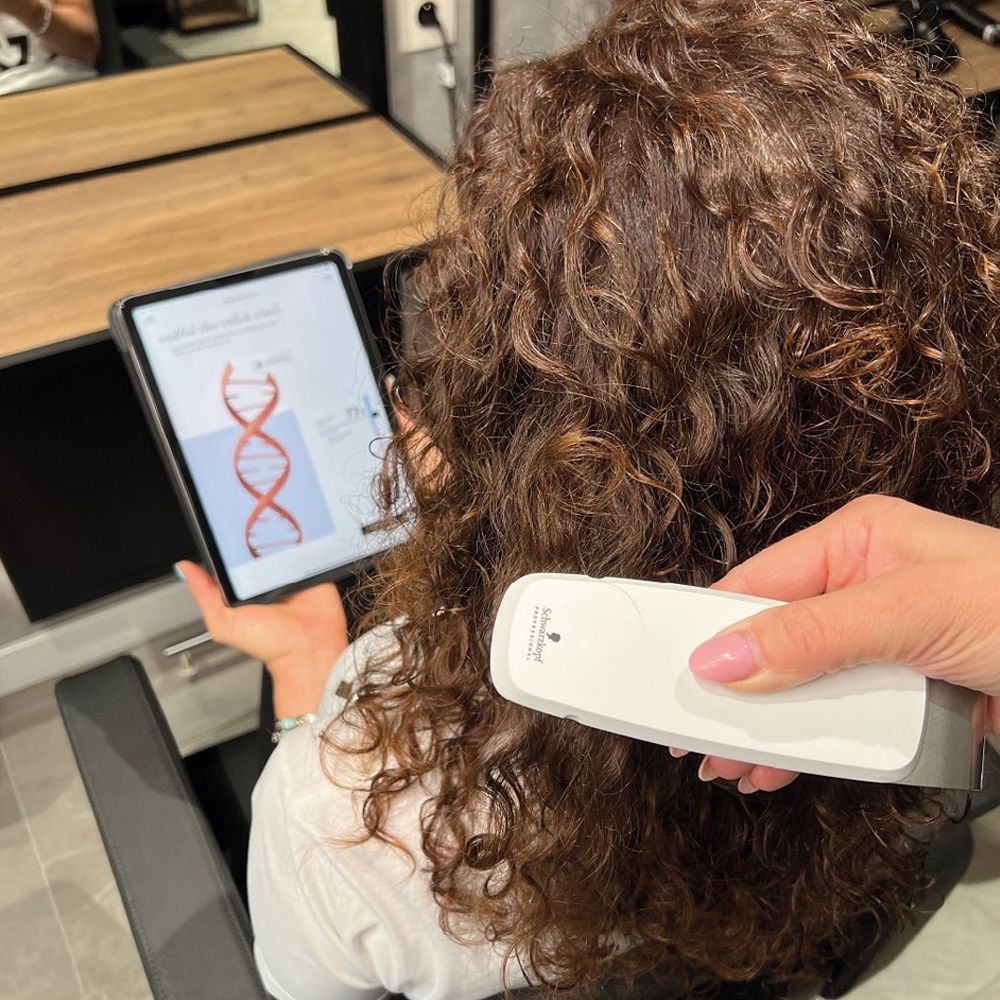 SalonLab hair analysis being used during a professional hair consultation
