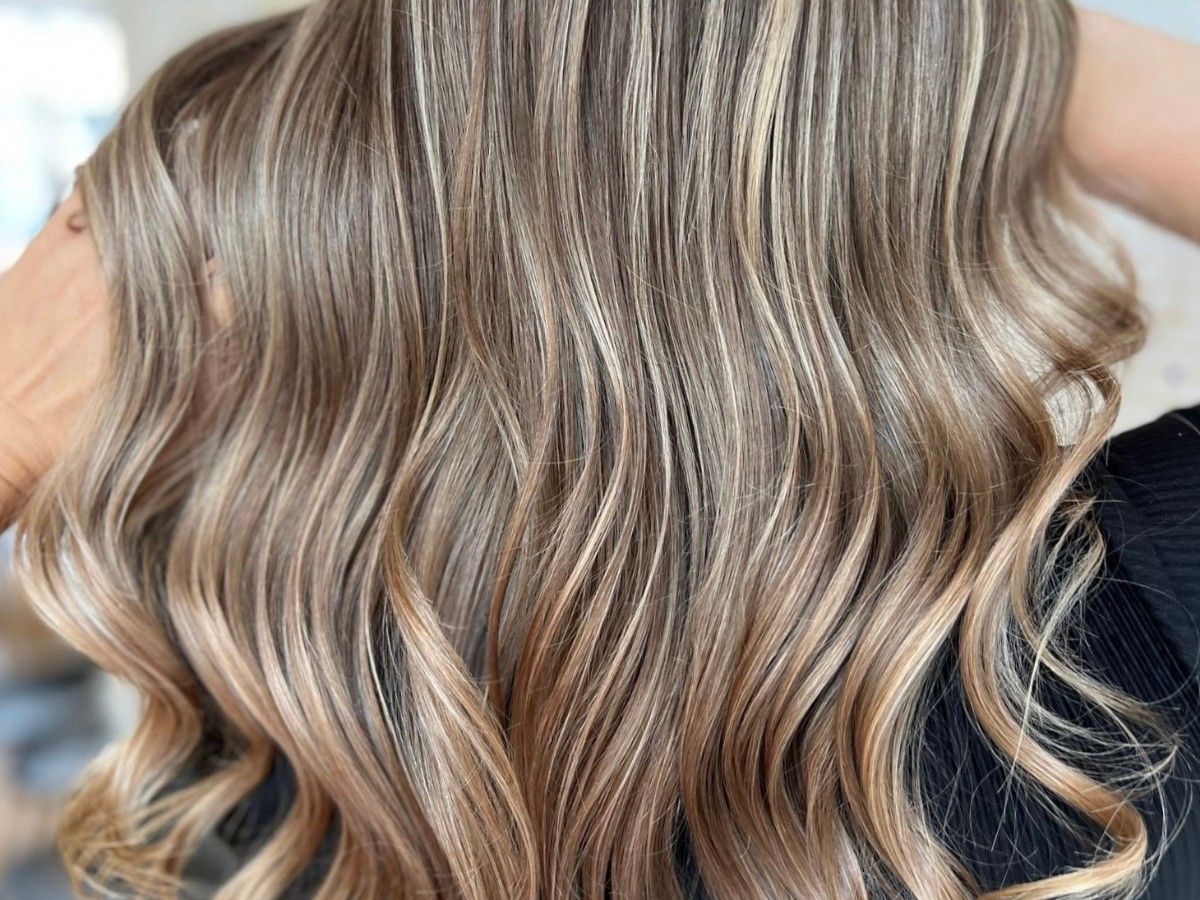 Dimensional balayage showing soft grow-out and blended colour