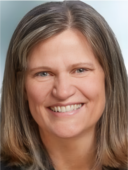 A woman with long hair is smiling for the camera