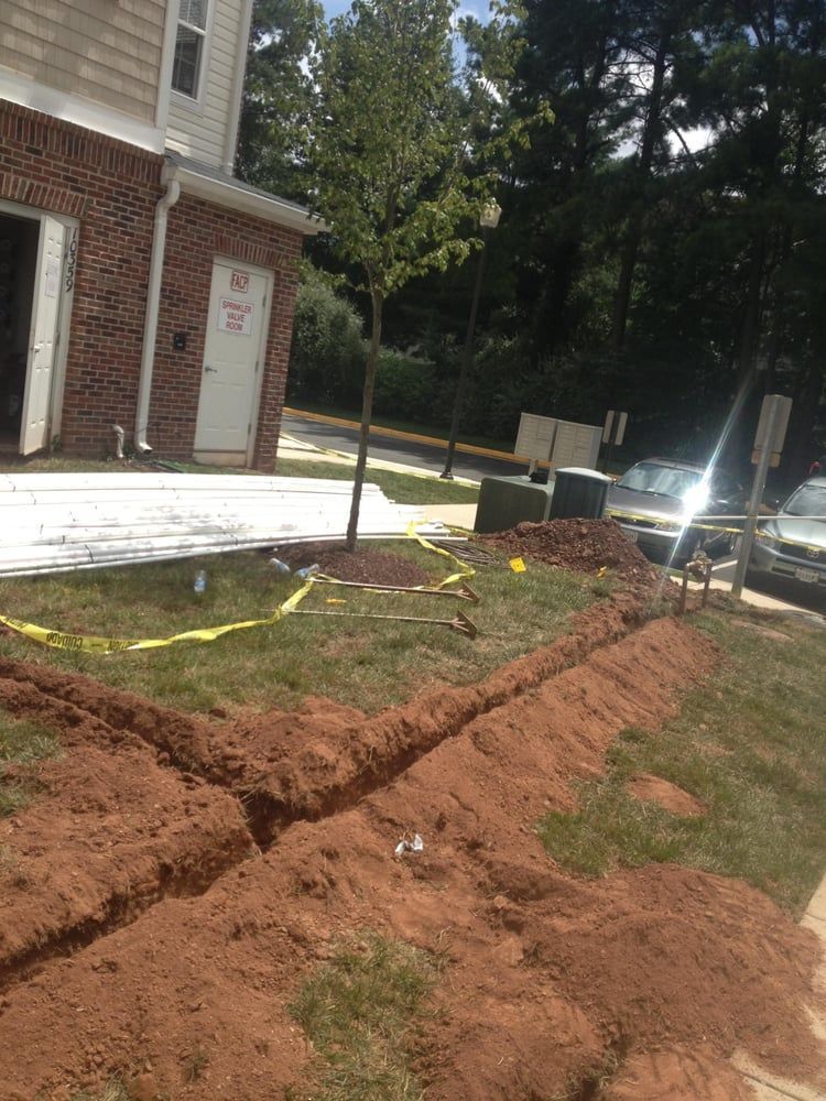 A house is being remodeled with a lot of dirt in front of it