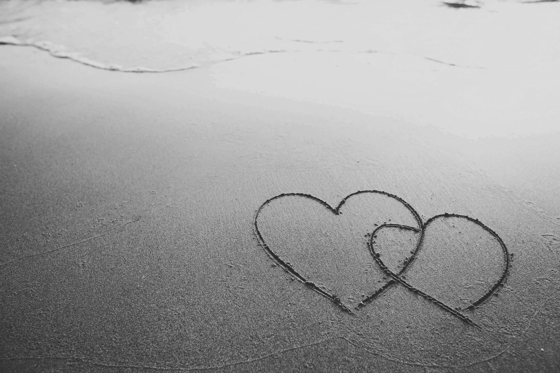 Love hearts in the sand