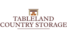 The logo for tableland country storage shows a fireplace with boxes in it.