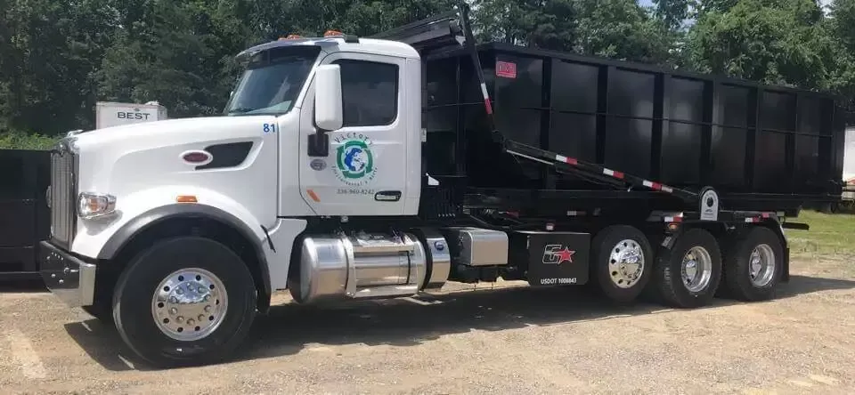 A dump truck is parked in a parking lot.