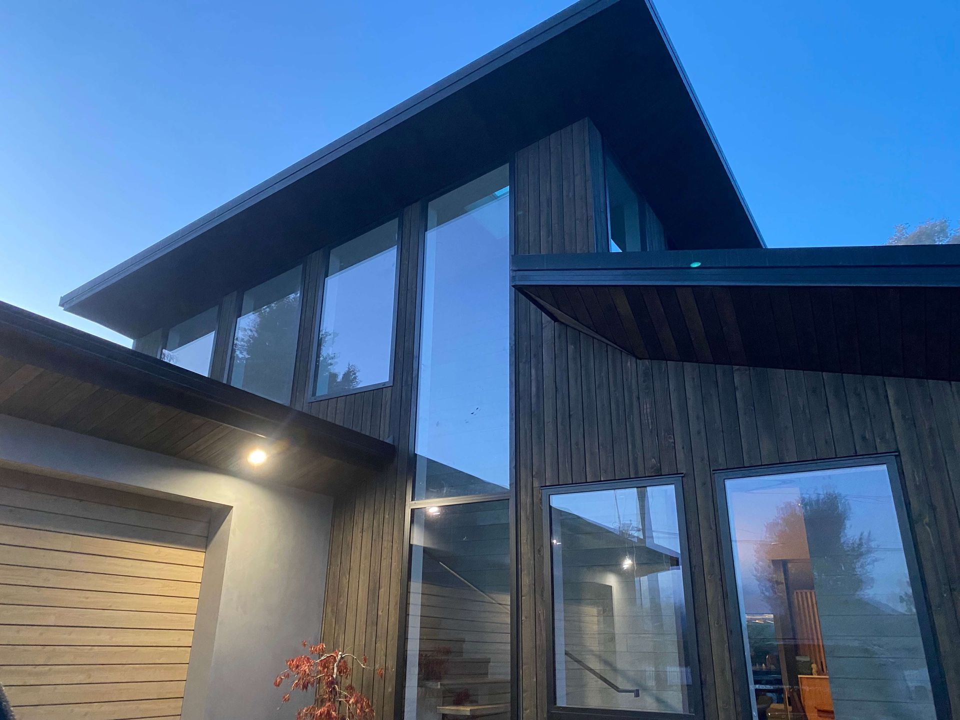 A modern house with a lot of windows and stairs. Statement Homes Christchurch