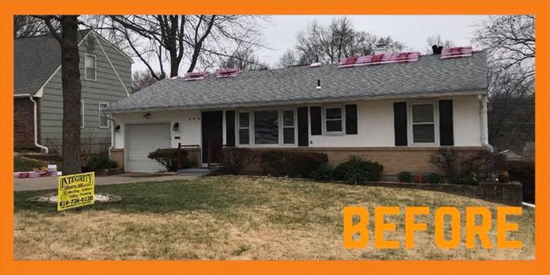 A before picture of a house with a roof being installed