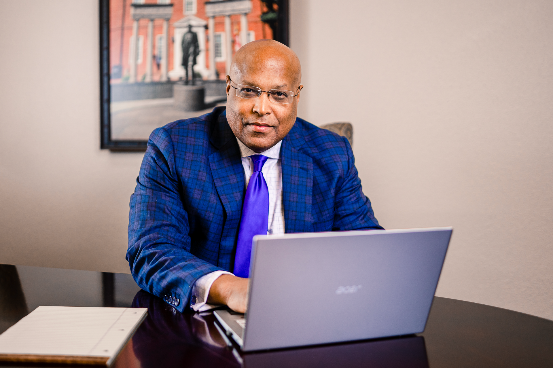 Looking up at a tall building with a blue sky in the background.