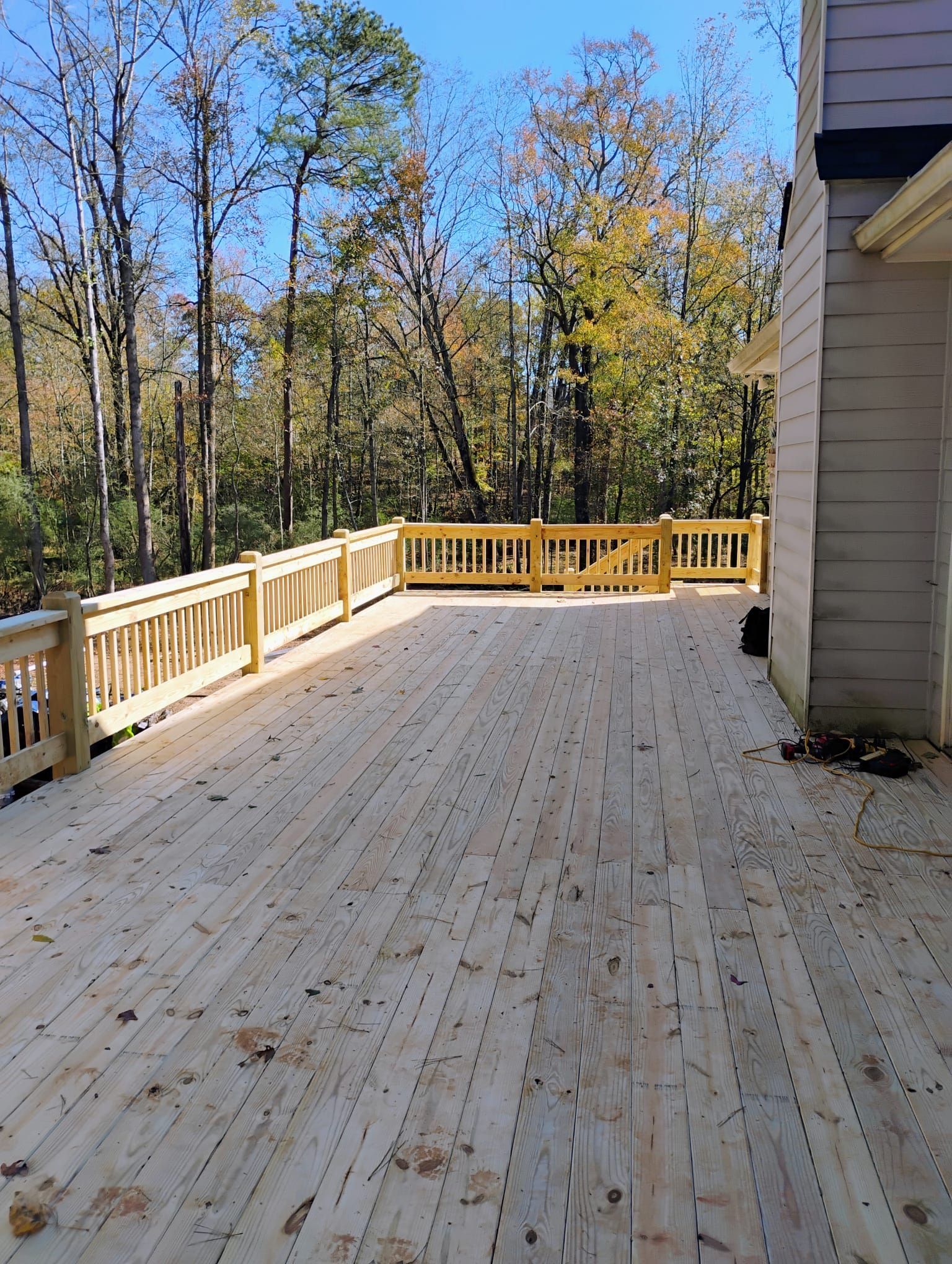 A wooden fence in the backyard of a house