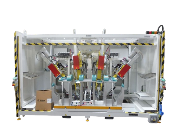 Machine de soudage automatisée avec robots dans une enceinte blanche ; barrières et boîtes de sécurité présentes.