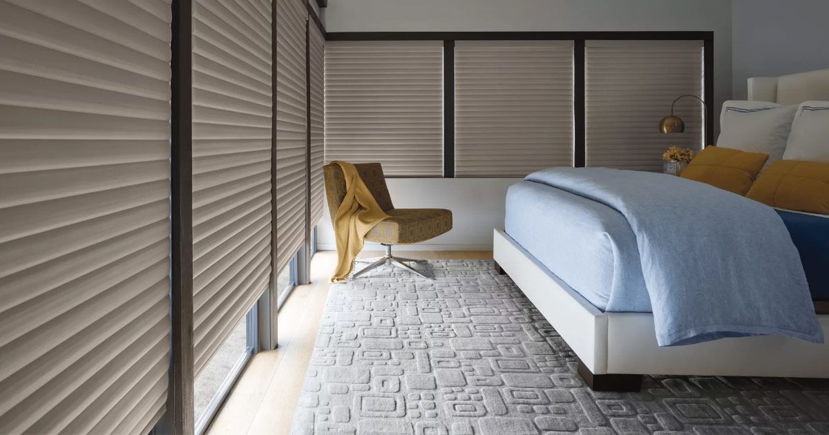 a wooden cabinet with clothes and a bag in it .