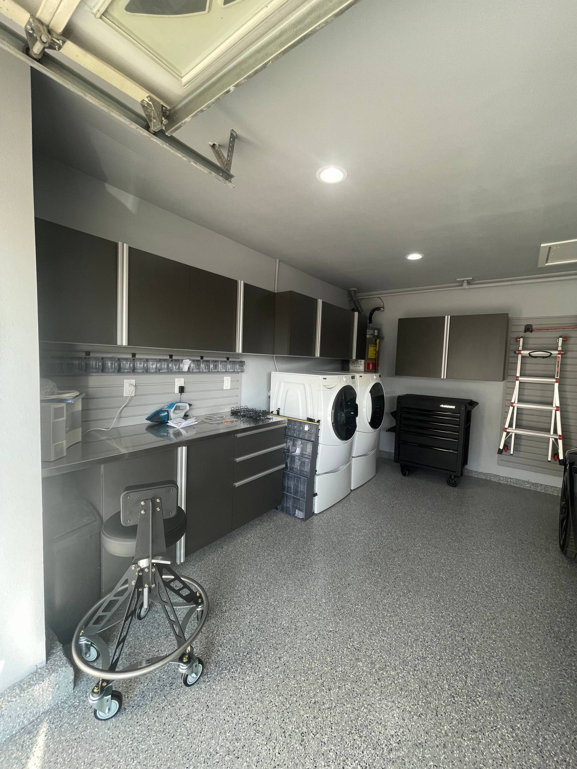 a garage storage system with a washer and dryer in it