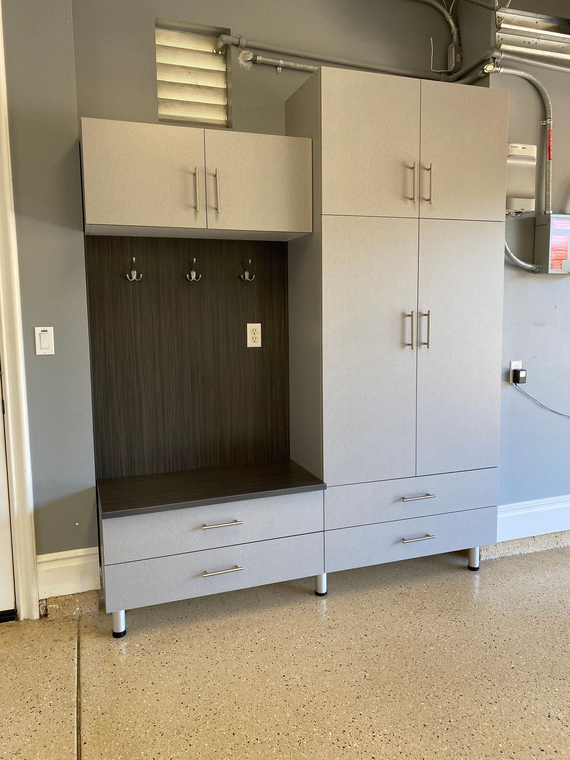 a custom garage mudroom cabinet system