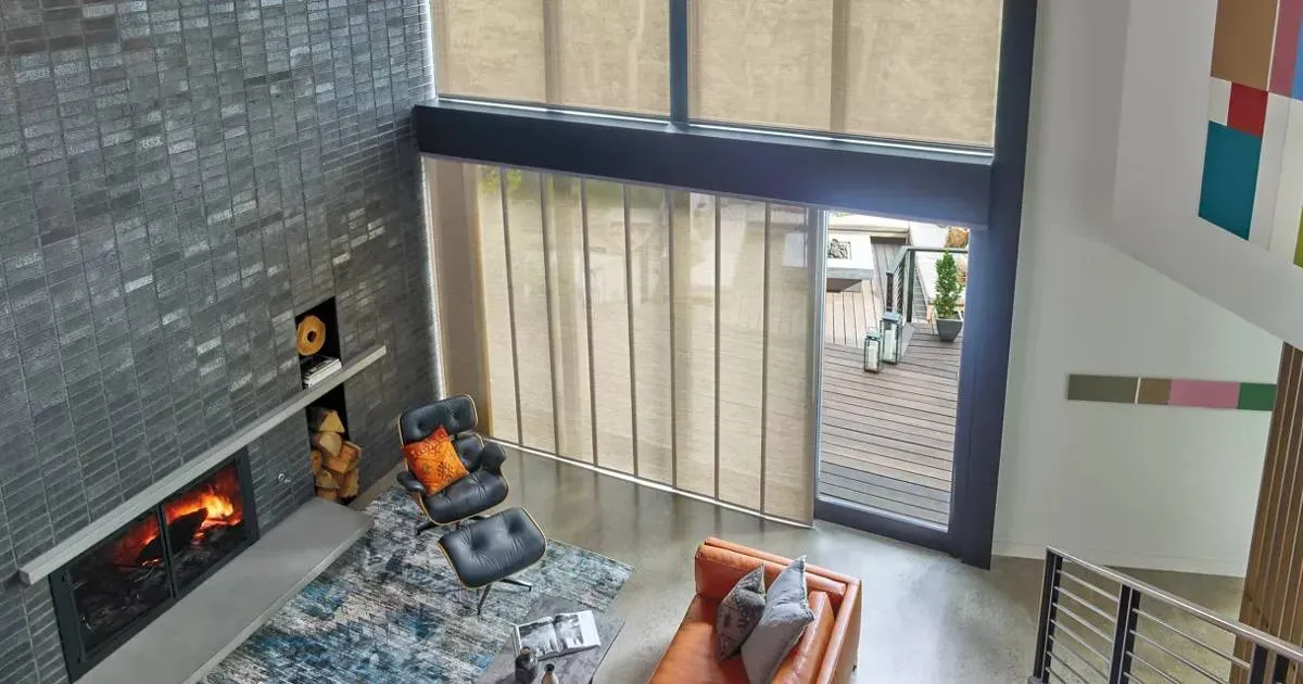 An aerial view of a living room with a fireplace and a couch.