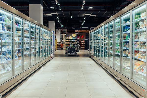 Empty Supermarket Aisle with Refrigerators — Cambridge, OH — RC Rogers Company LLC