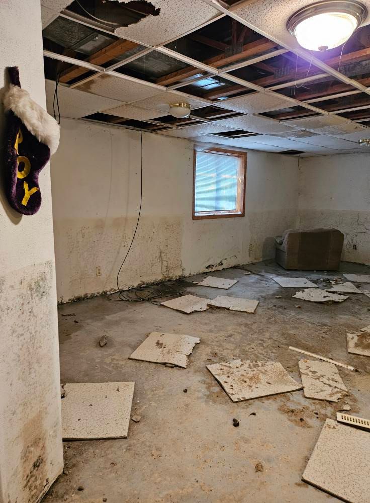 An empty room with a christmas stocking hanging on the wall.