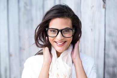 Smiling beautiful brunette looking at camera — Premium Eyeglasses in Rapid City, SD