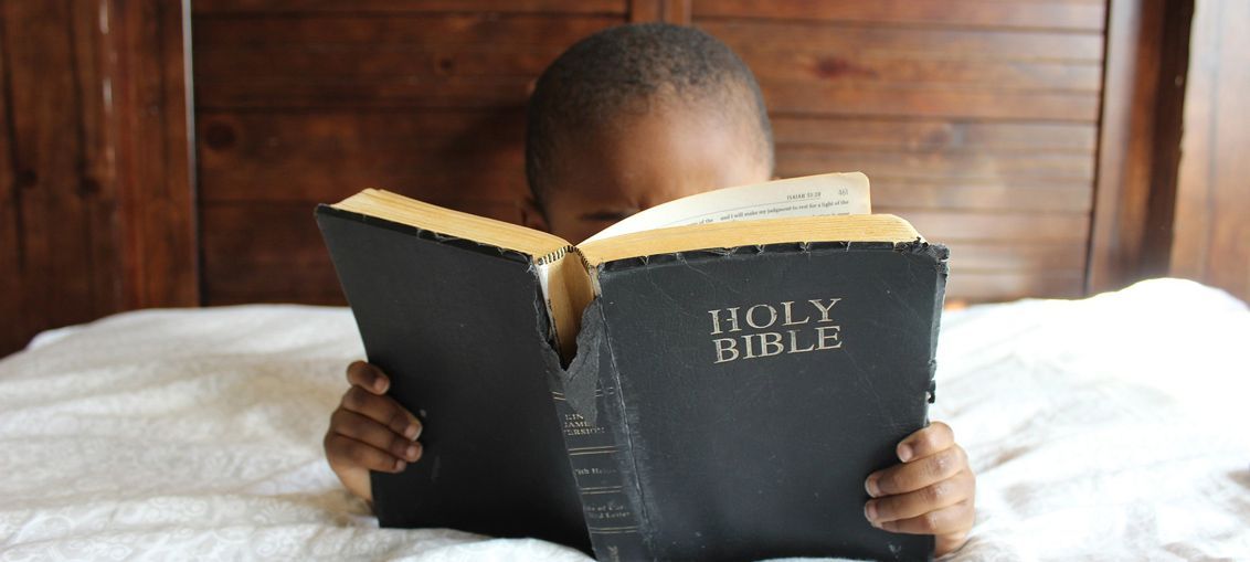 A group of young people are posing for a picture together and smiling.