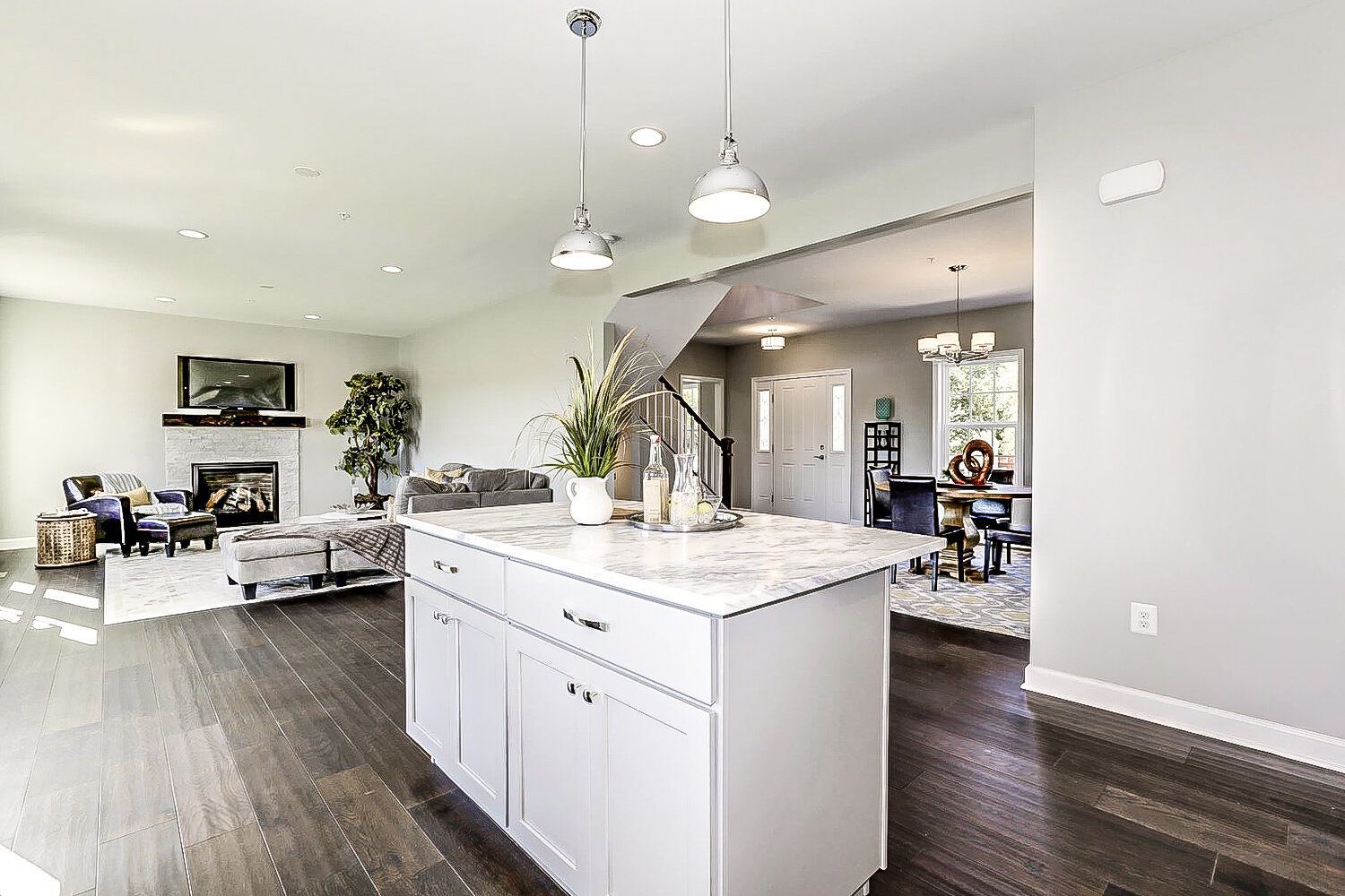 A kitchen with a large island in the middle of the room.