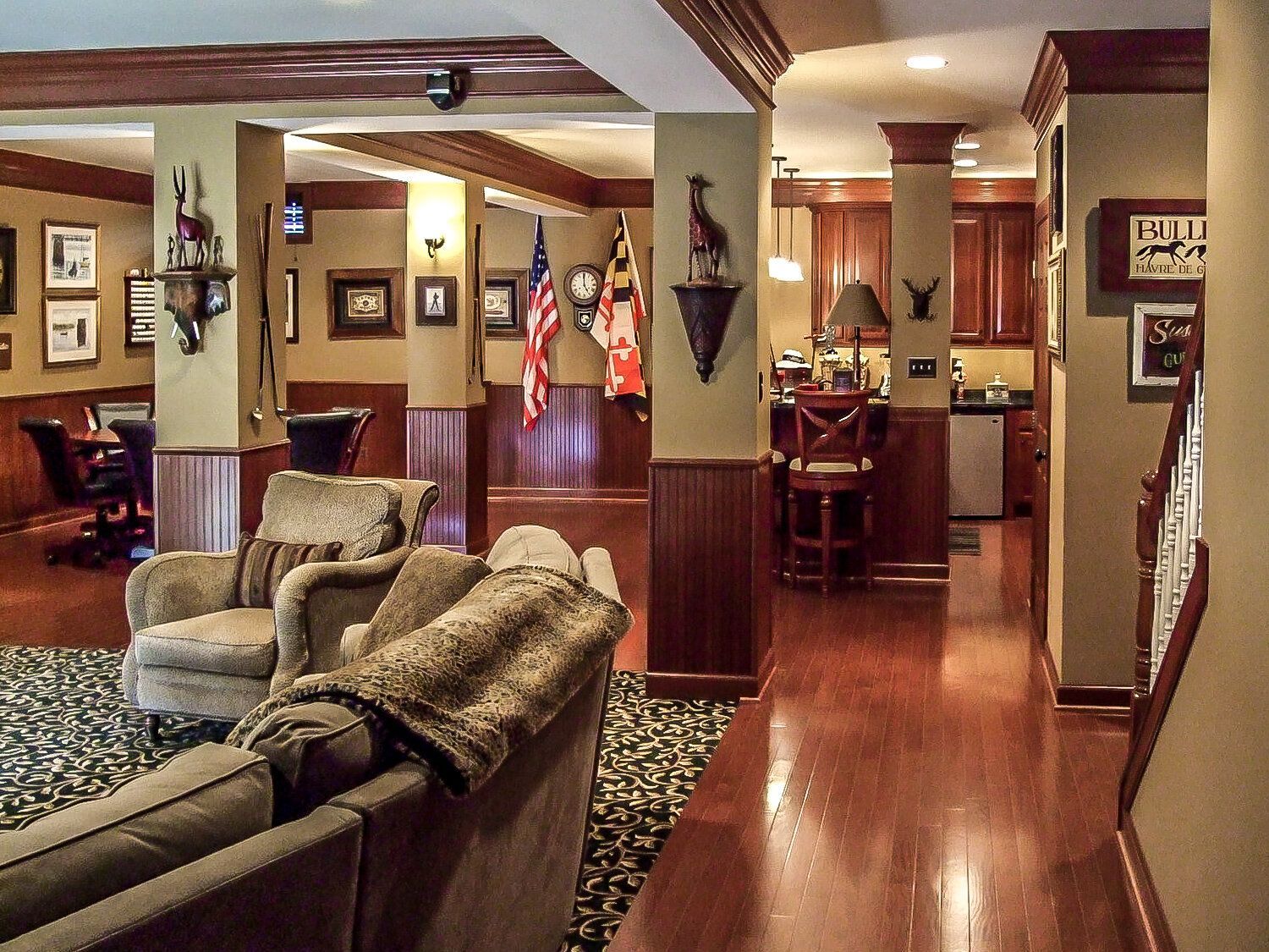 A living room with a couch and chairs in it