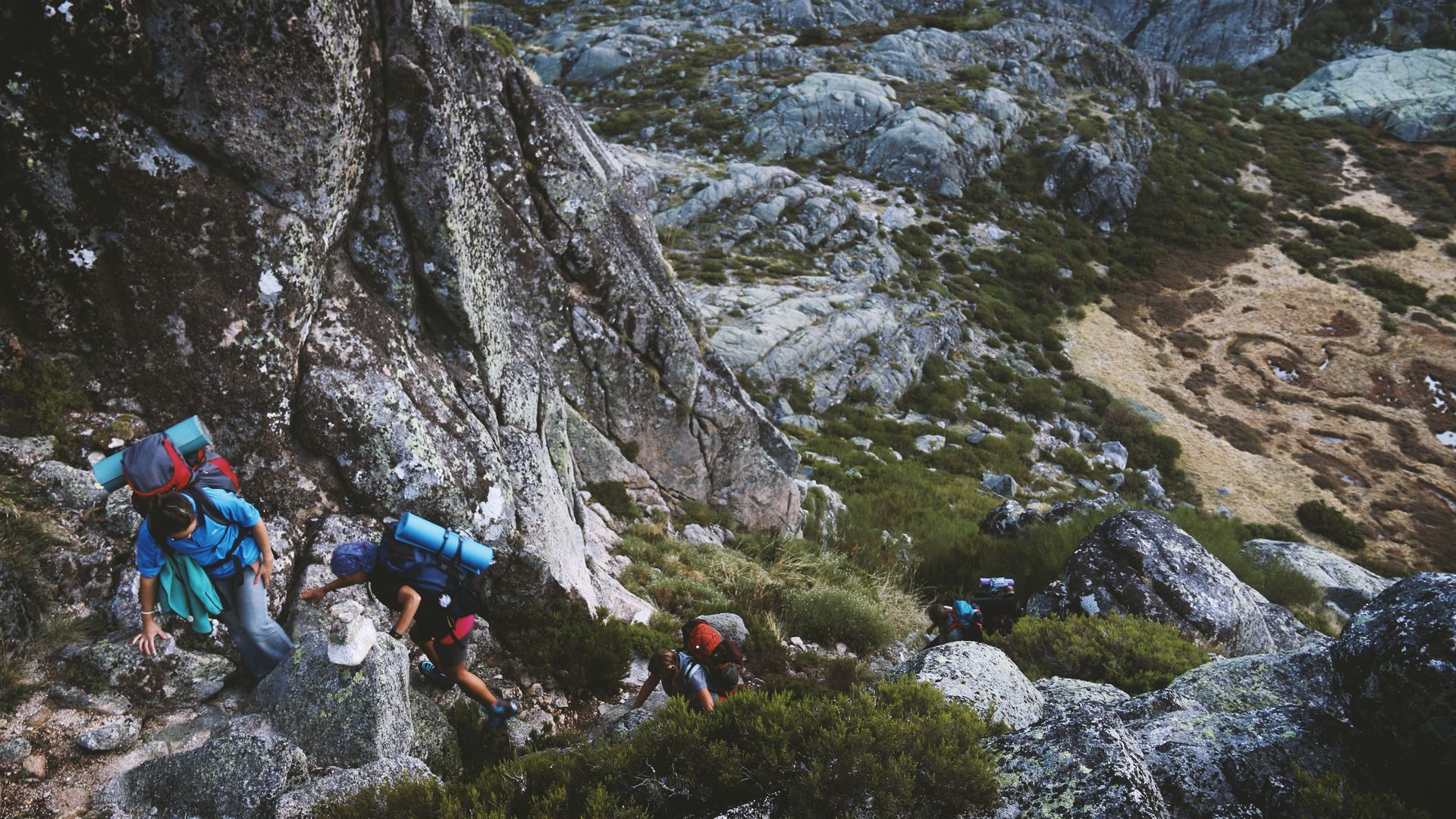 A group of people are hiking up a mountain.