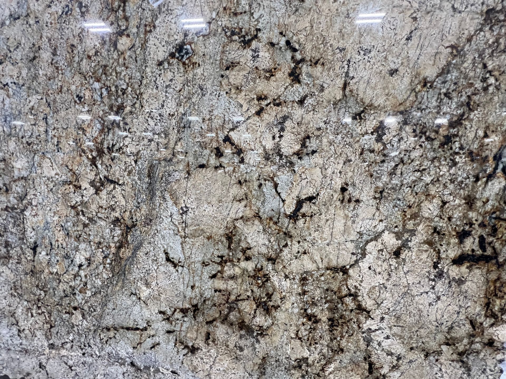 A close up of a granite counter top with a marble texture.