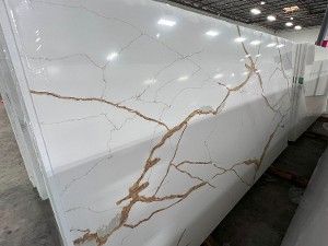 A close up of a white quartzite counter top with a cracked pattern.