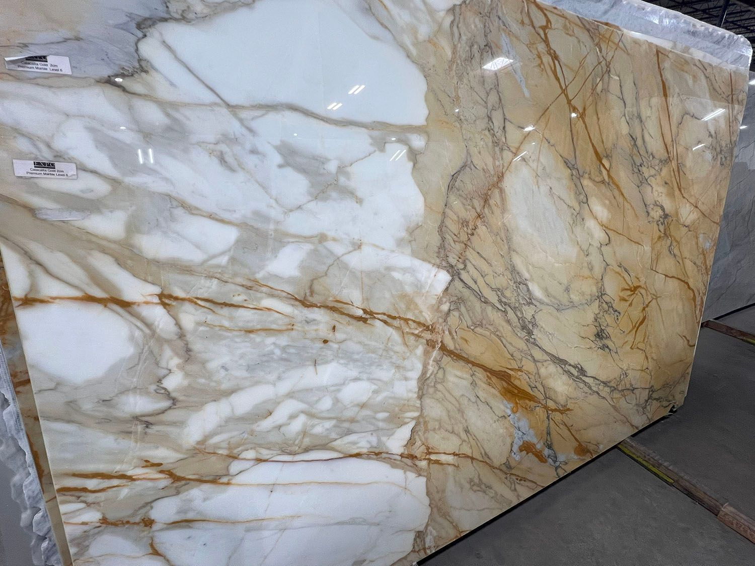 Large slab of marble with white and gold veining.