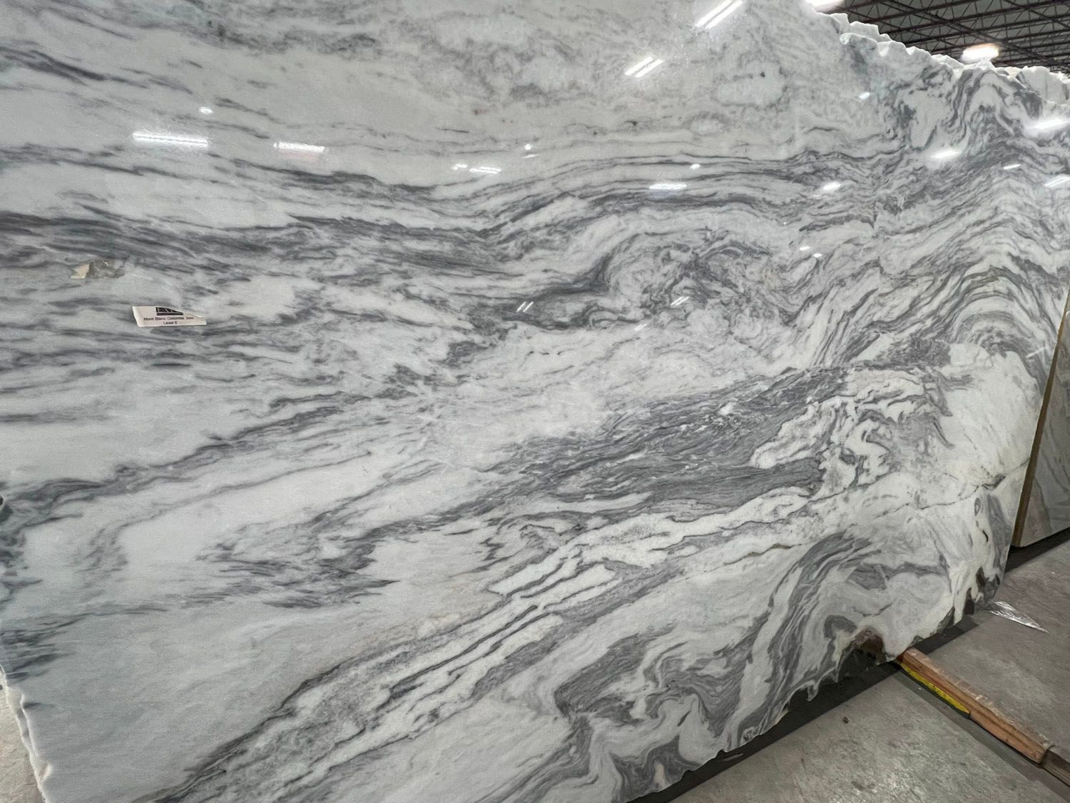 Large slab of white marble with gray veining.