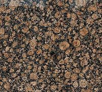 Brown speckled granite countertop with lighter brown orb-like patterns.