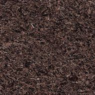 Dark brown mulch, consisting of shredded organic matter.