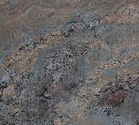 Granite countertop with swirled patterns in shades of gray, blue, and brown.
