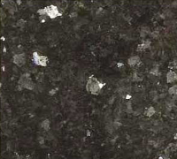 Dark granite with scattered silver flecks.