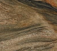 Brown and gold granite with swirled patterns and dark streaks.