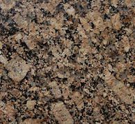 Brown and black granite countertop, speckled texture.