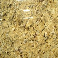 Golden-toned granite countertop with dark brown and beige specks.