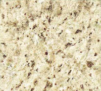 Close-up of granite with a light beige background and dark brown and black flecks.