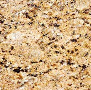 Close-up of a tan granite countertop with dark brown and black flecks.