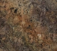 Brown, black, and gold granite stone surface.