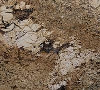 Tan, brown, and cream-colored granite stone with speckled and veined patterns.